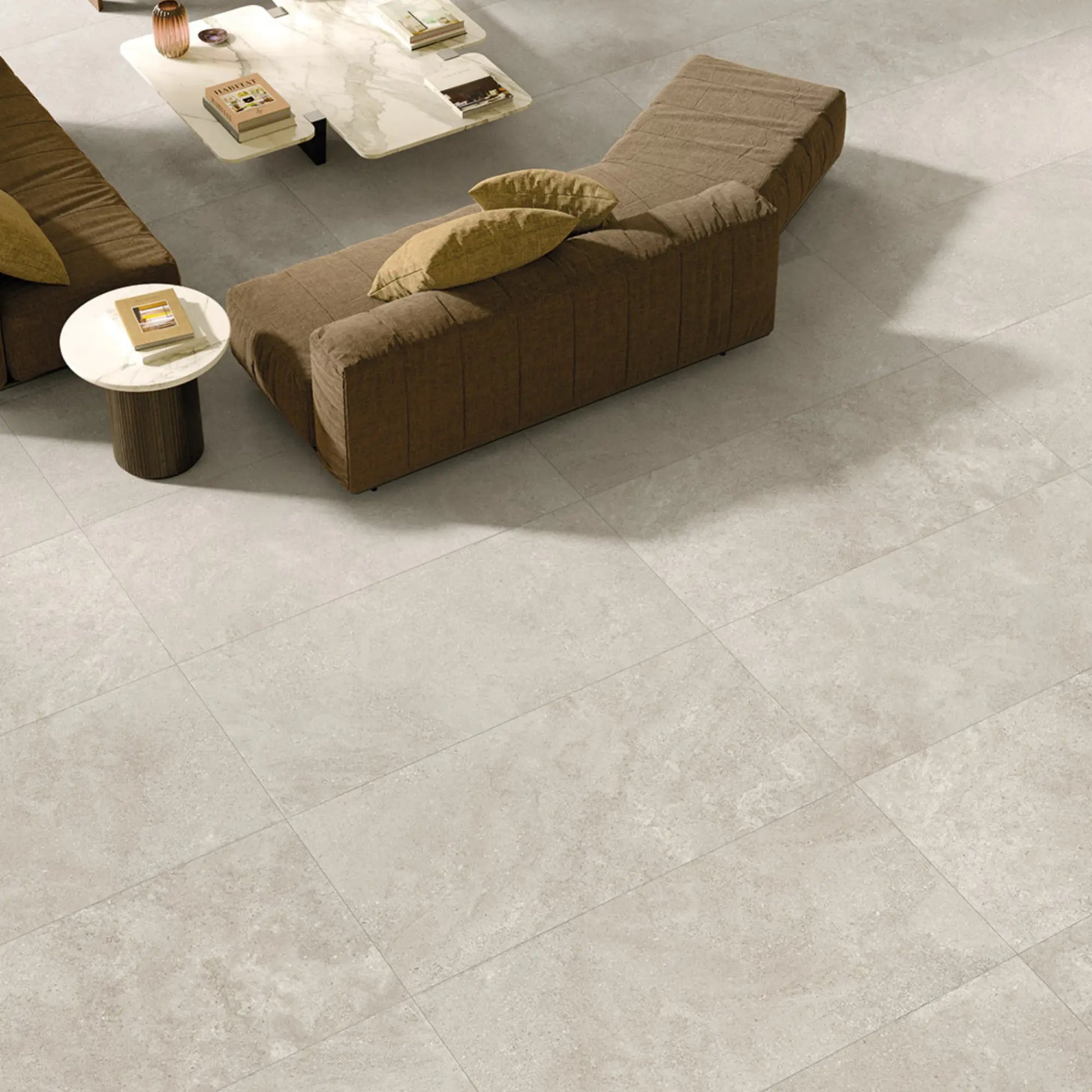 Light grey stone effect porcelain tiles in open space interior – Eterea Perla