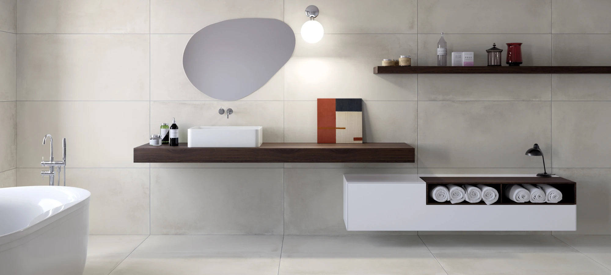 Modern bathroom with large-format grey porcelain tiles on walls and floor.