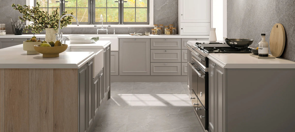 Grey stone-effect porcelain floor tiles in a modern kitchen interior.