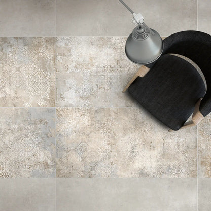 Top view of porcelain stoneware decorative floor tile with subtle beige and grey pattern.