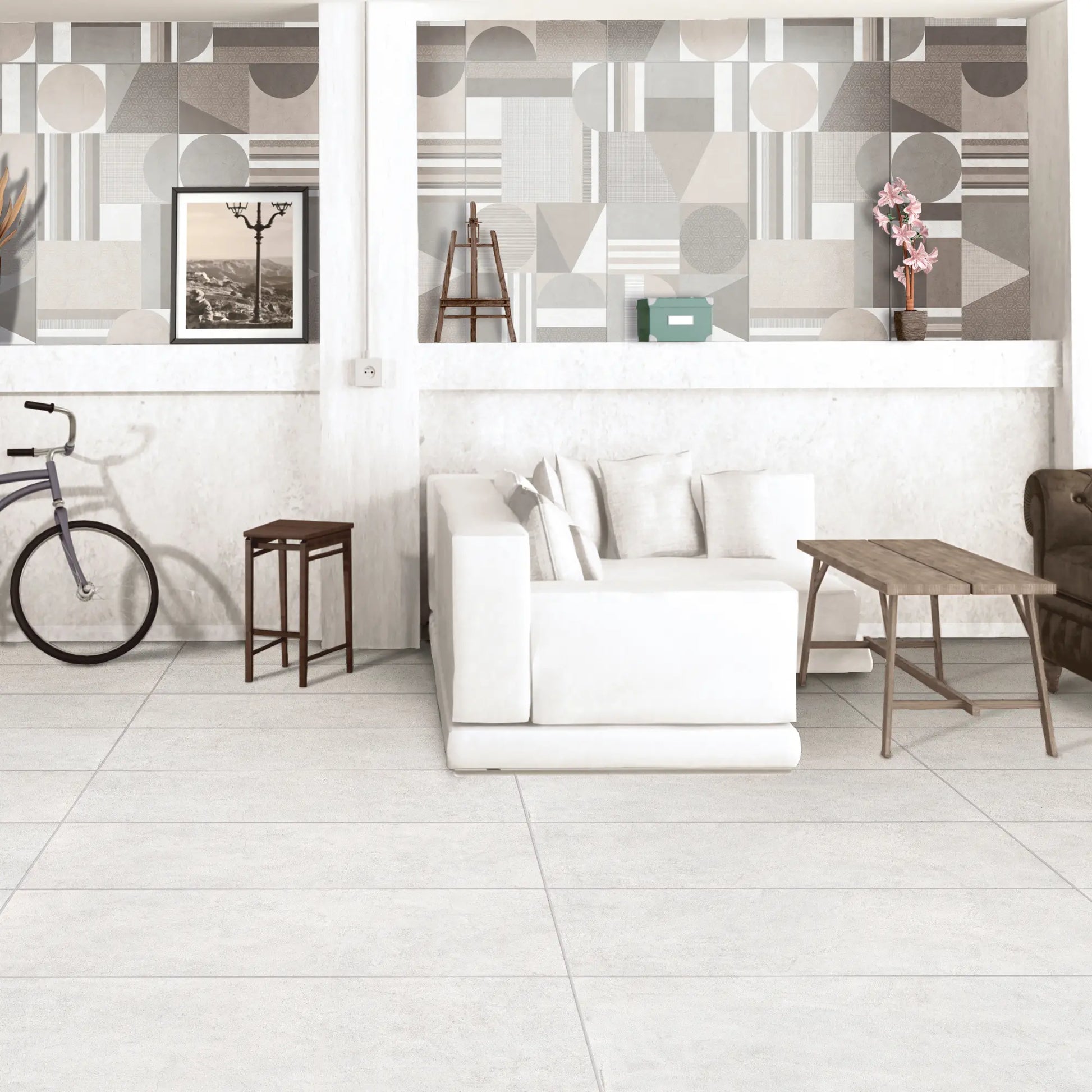 White concrete-effect porcelain flooring in a bright open space interior, Le Resine Bianco