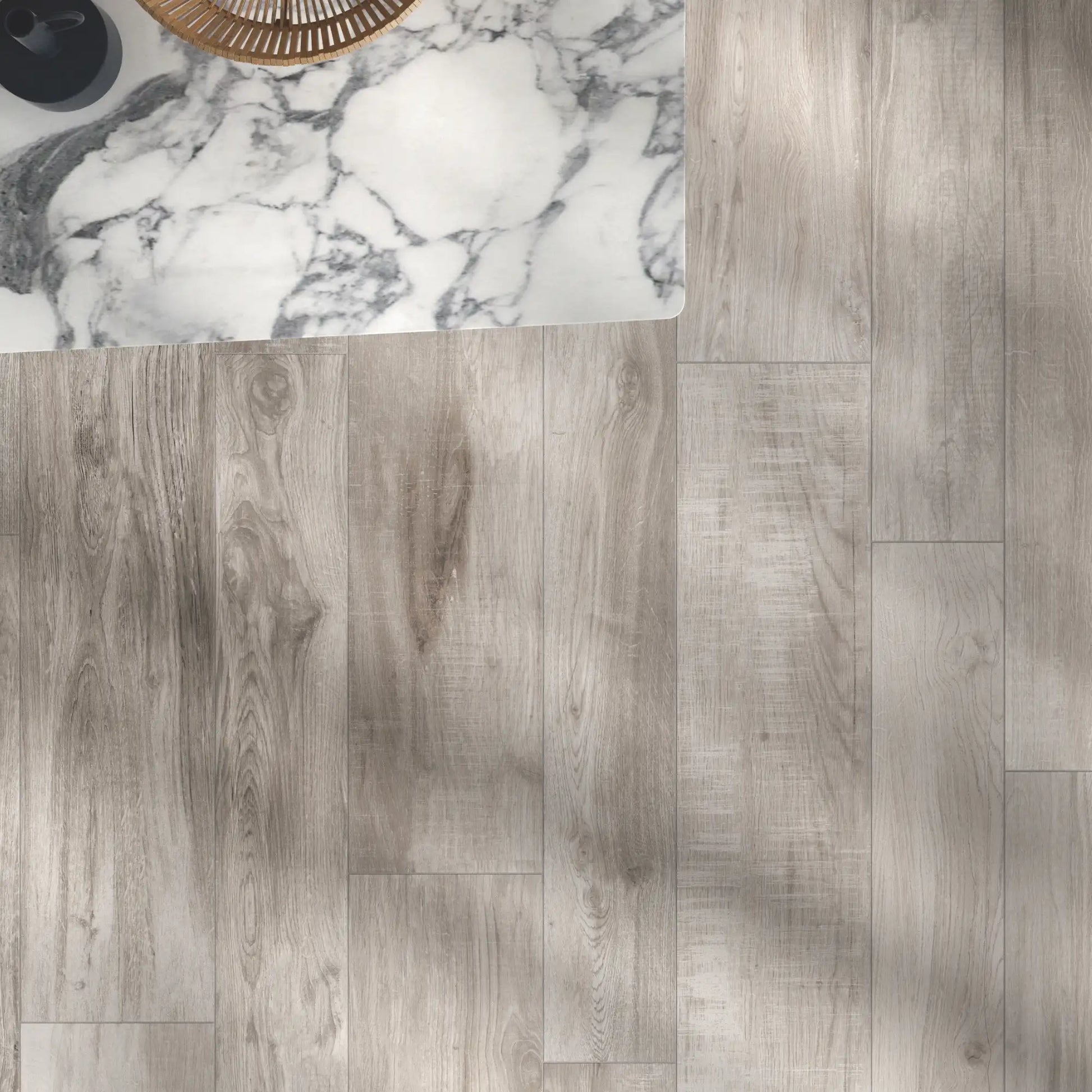 Top view of grey oak wood-effect porcelain flooring with natural grain and soft tonal variation – North Wind Grey
