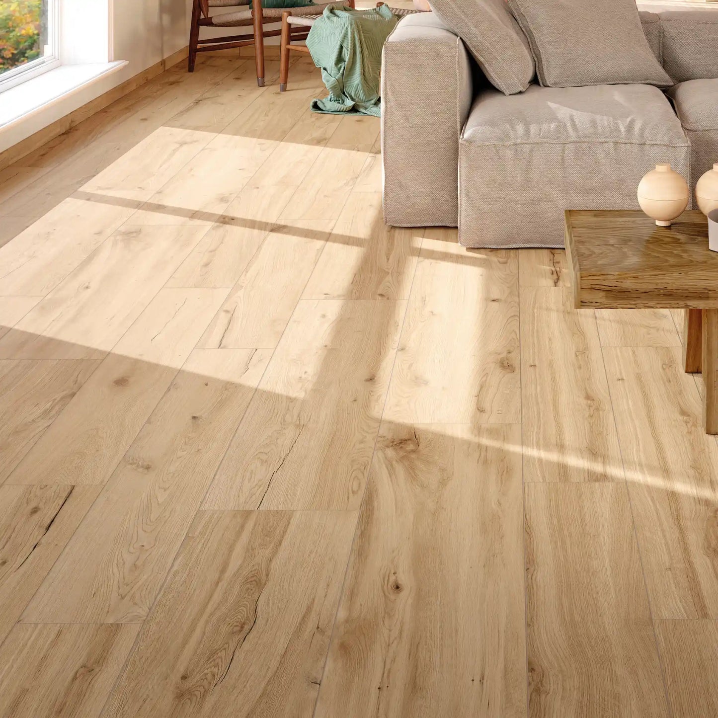 Close-up view of light oak wood-effect porcelain tiles in a modern living room – Natura Betulla