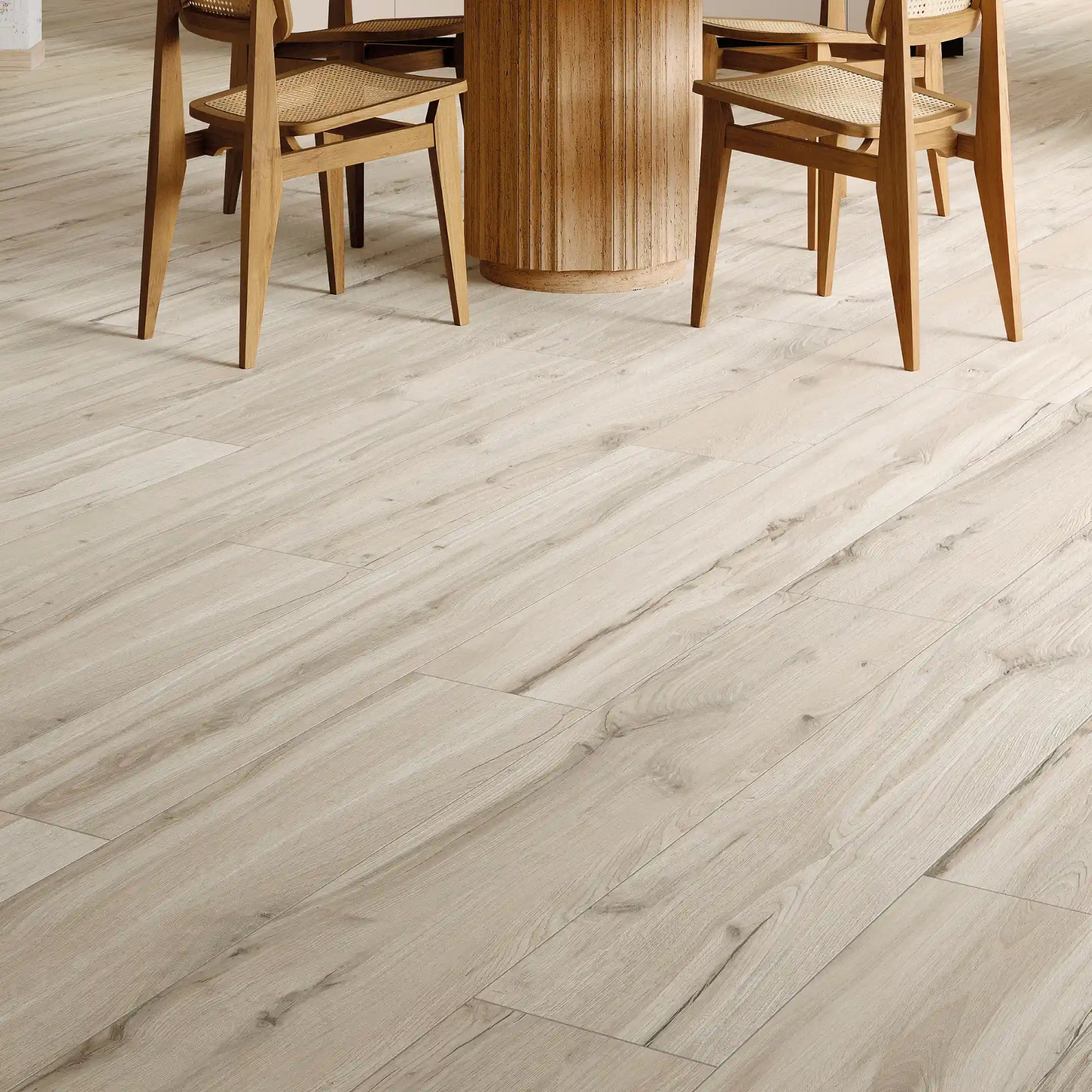 Light wood-effect porcelain flooring in a modern dining room, close up – Natura Magnolia