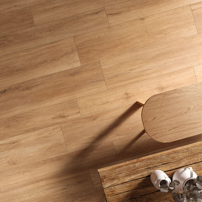 Top view of natural oak wood-effect porcelain flooring with warm light and subtle grain variations – Firenze Naturale