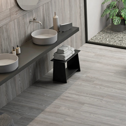 Light grey wood-effect porcelain tile flooring in a contemporary bathroom - Skyline Grey