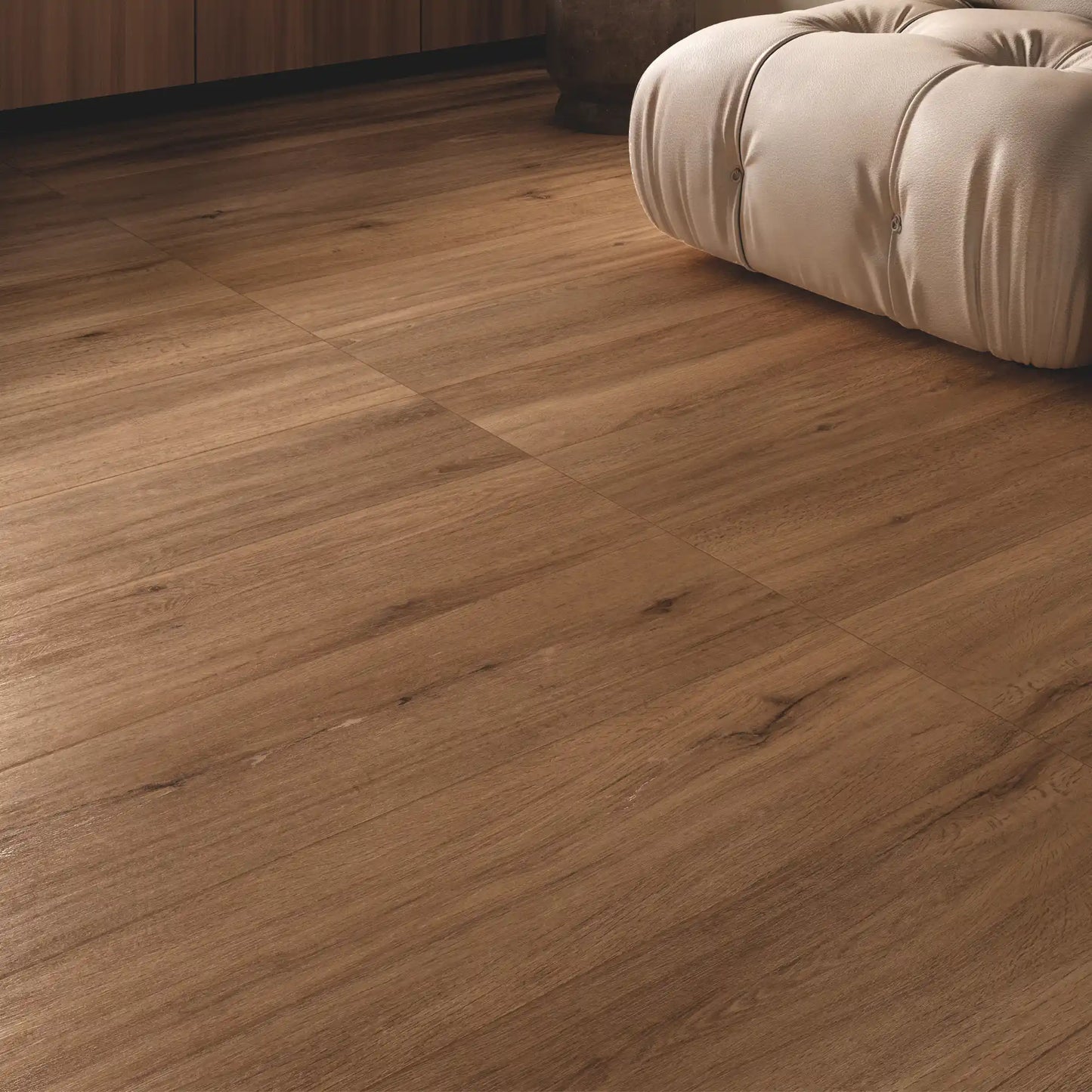 Close-up of warm oak wood-effect porcelain tiles in a modern interior – Firenze Ceraso