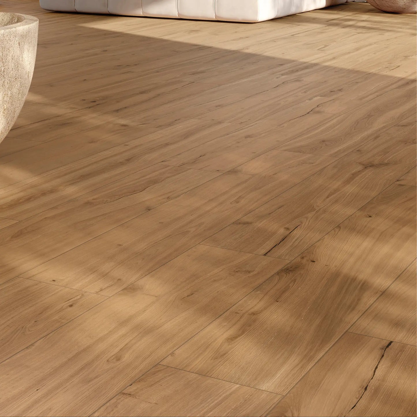 Close-up of warm oak wood-effect porcelain tiles showing natural grain and warm texture – Natura Ciliegio