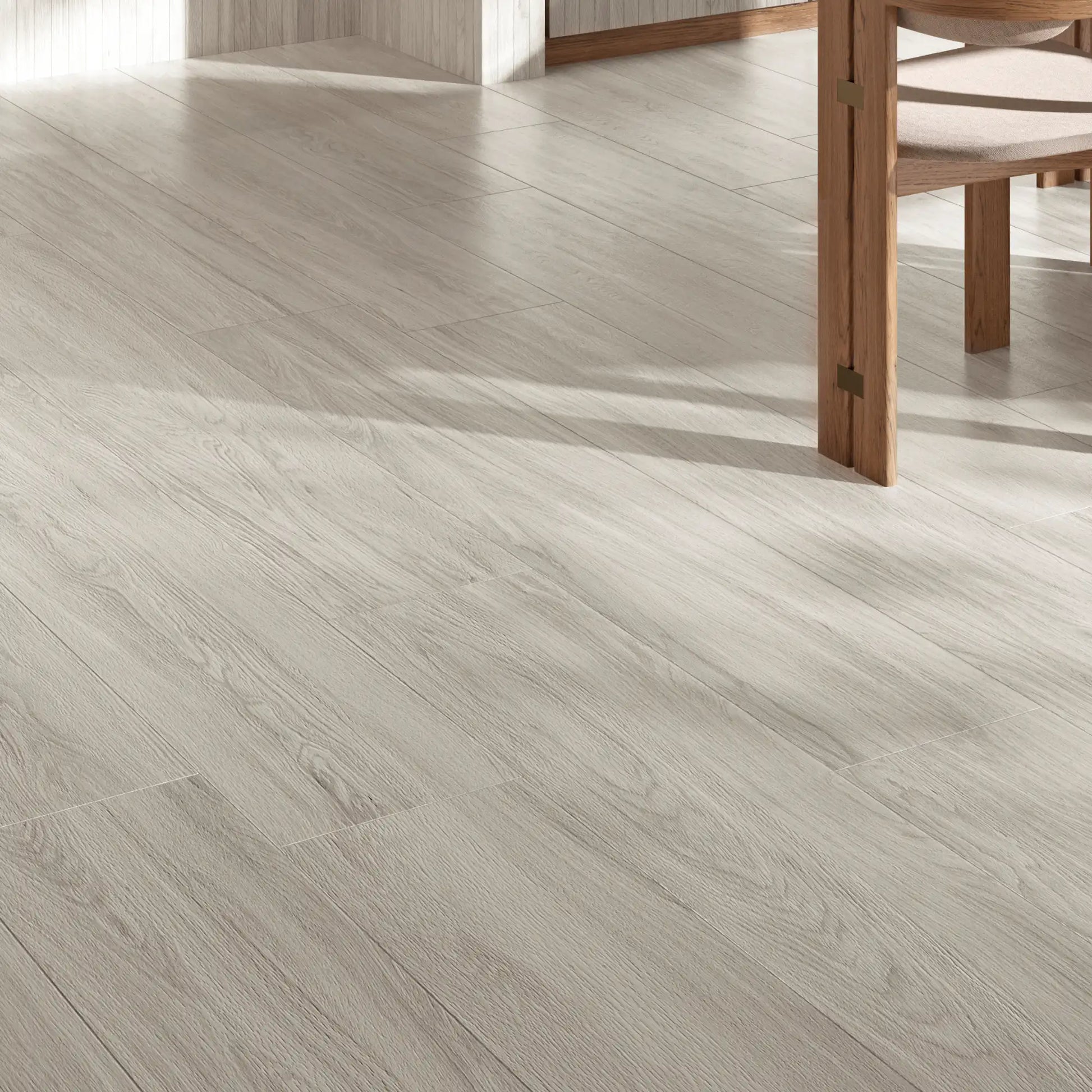 Close-up of white oak wood-effect porcelain tiles with natural grain in a bright modern interior – Skyline White